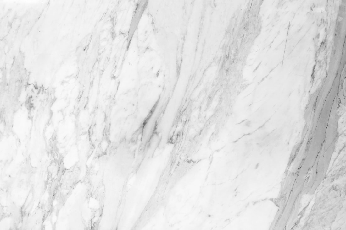 Close-up of white Carrara-style marble with grey veining