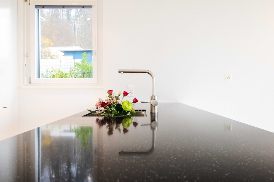 Polished black granite counter with a modern faucet